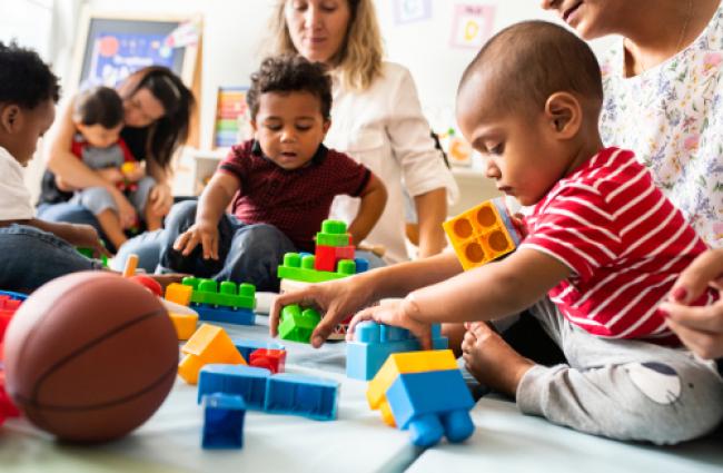 Children and parents playing with blocks