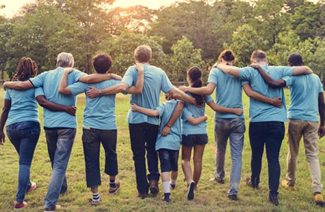 People embracing each other with back to camera