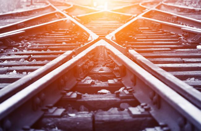 Image of two train tracks crossing.