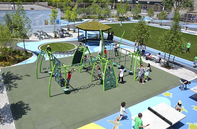 Image of children playing on playground equipment.