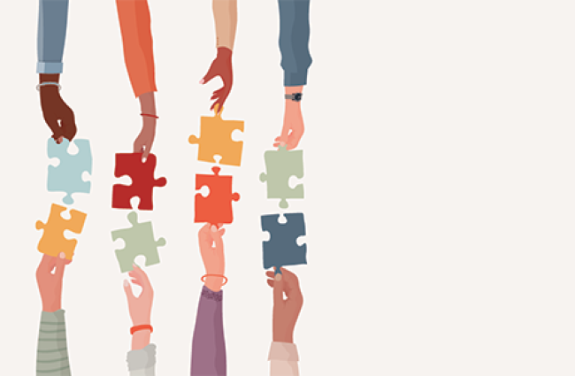 Diverse people’s arms and hands holding one jigsaw puzzle piece joining the other piece