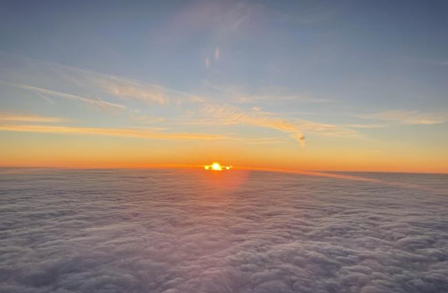 Sun rising above the clouds