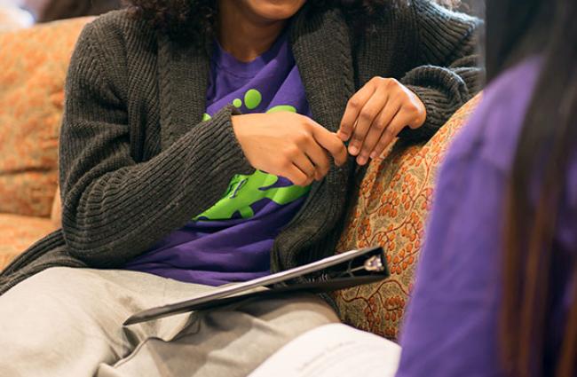 Students talking on a couch
