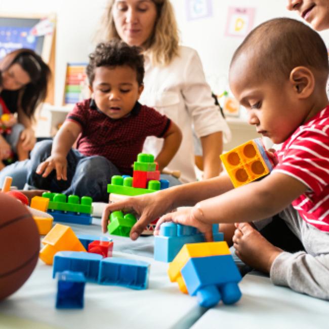 Children and parents playing with blocks