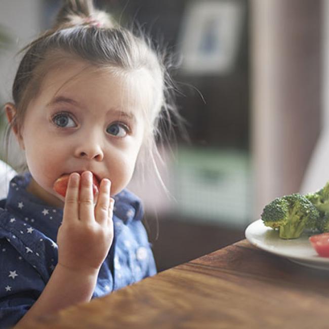 Child eating fruits and vegetables