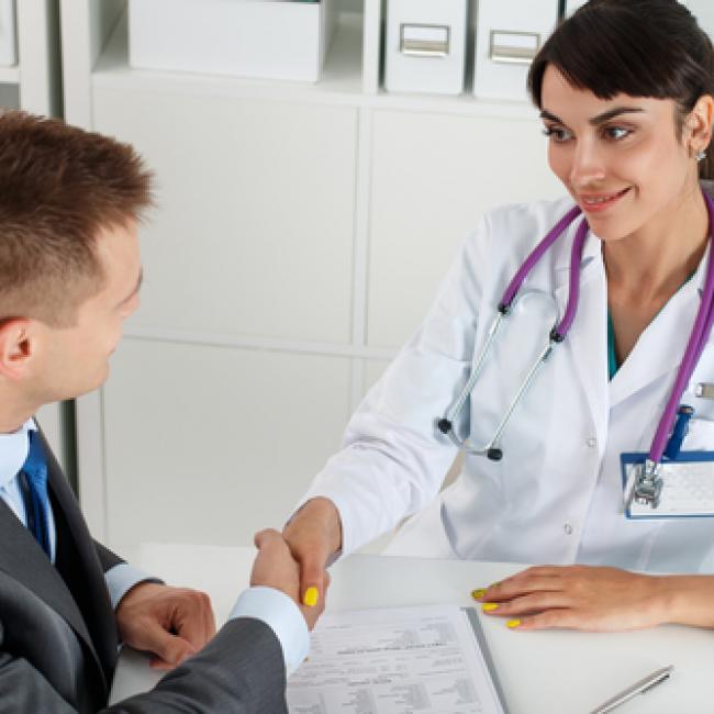 Doctor and patient shaking hands