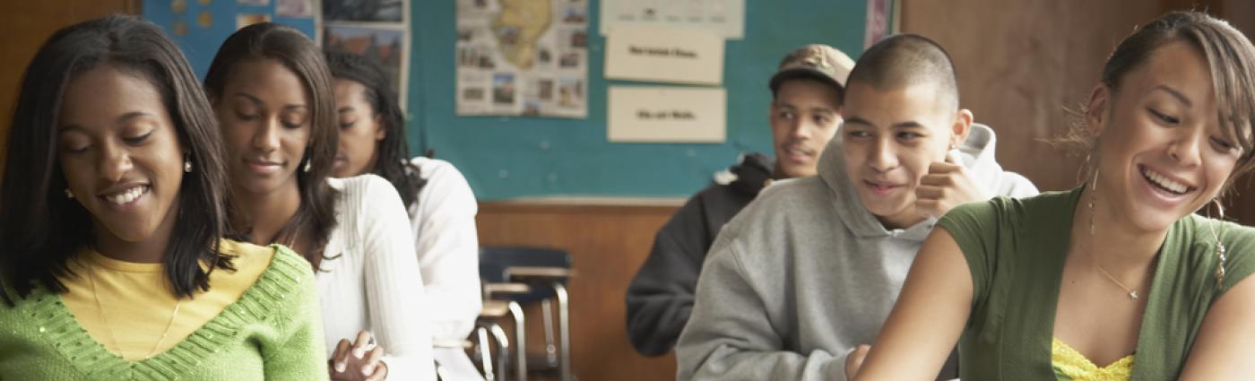 Young teens in class at their desks