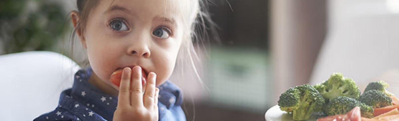 Child eating fruits and vegetables