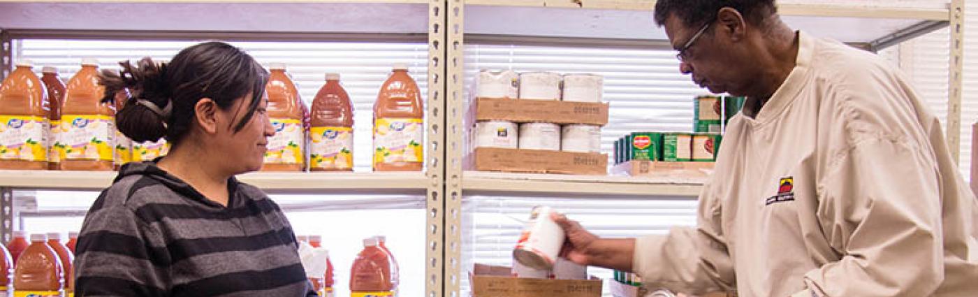 Image of two people at a food bank