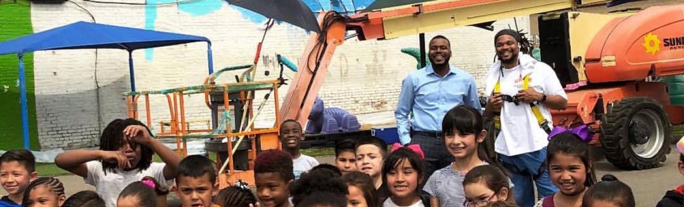 Image of a group of children in front of a mural featuring Martin Luther King, Jr.