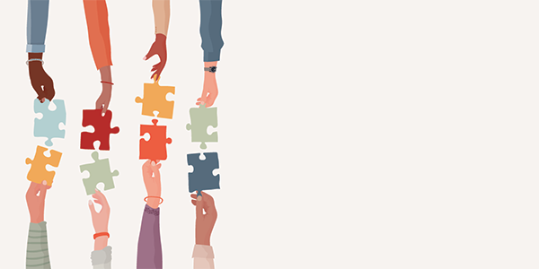 Diverse people’s arms and hands holding one jigsaw puzzle piece joining the other piece