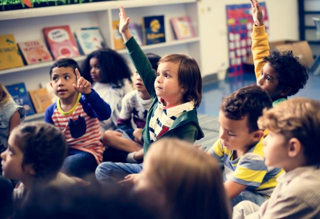 Happy children, aged 6 or 7, in a school-based setting