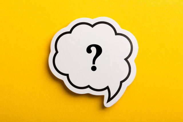 Yellow background with black thought bubble around a question mark