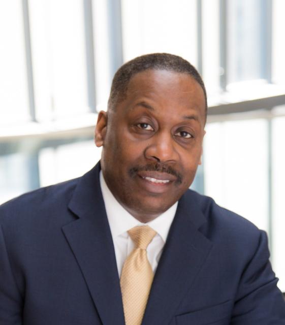 Dr. Thomas A. LaVeist, a smiling Black man in a suit and tie