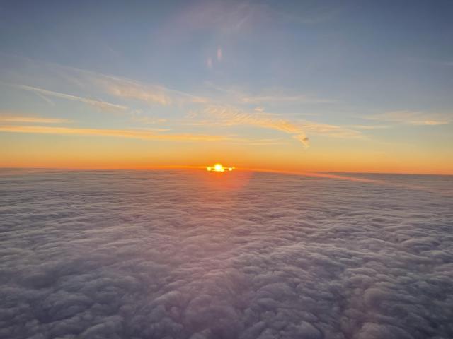 Sun rising above the clouds